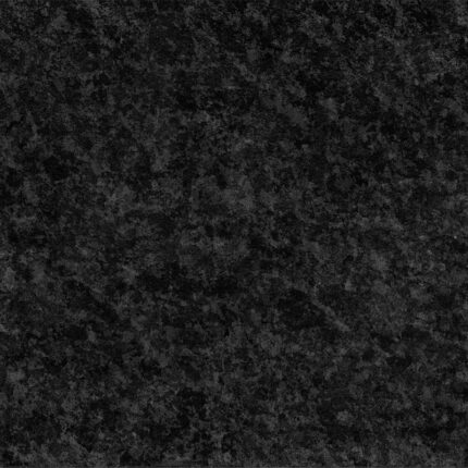 a close-up of polished black stone with a smooth and shiny surface, characterized by a uniform dark color and subtle texture.