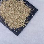 Small, oval-shaped seeds with a grayish-green color and a pungent aroma. Also known as carom seeds, they have a distinct and strong flavor similar to thyme or oregano. Ajwain seeds are commonly used as a spice in Indian cuisine for their unique taste and potential digestive and medicinal properties.