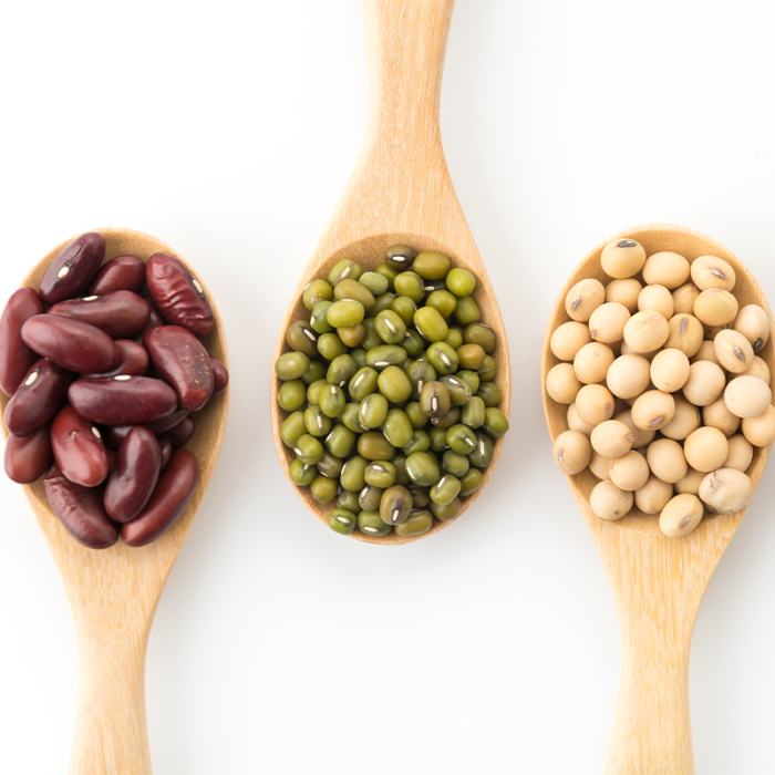 Assorted Beans In A Colorful Mix, Showcasing A Variety Of Shapes, Sizes, And Colors. The Beans Include Red Kidney Beans, Black Beans, Pinto Beans, And White Cannellini Beans, Among Others. They Are Arranged In A Random Pattern, Creating An Appealing Visual Display. The Beans Are Nestled Together, With Some Beans Partially Overlapping Each Other.