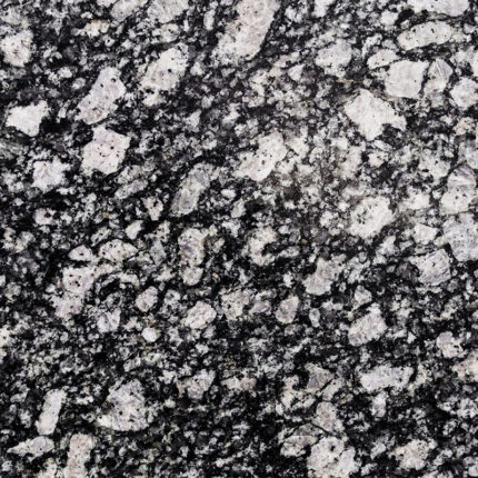 a luxurious natural stone with a deep black background and small white and gold flecks, adding a touch of sparkle and drama to any space.