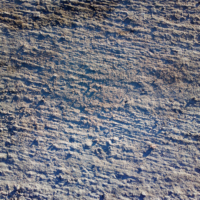 A Unique And Striking Natural Stone With A Blue-Gray Background And Waves Of White And Beige, Resembling The Movement Of Sand Dunes.