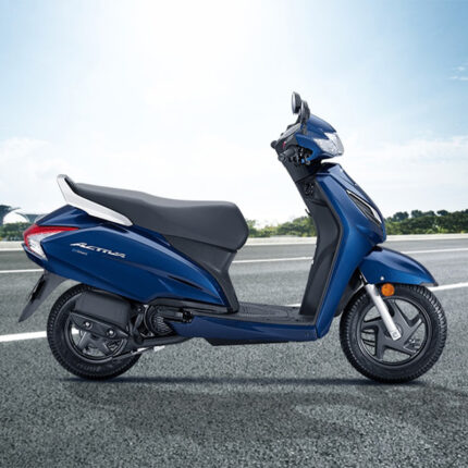 The scooter has a sleek design with a streamlined body, a comfortable seat, and large wheels for smooth maneuverability. The Activa is known for its reliable performance, fuel efficiency, and convenience, making it a popular choice for urban commuters and city dwellers.