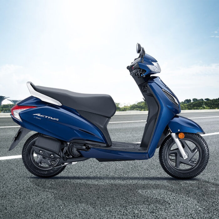 The Scooter Has A Sleek Design With A Streamlined Body, A Comfortable Seat, And Large Wheels For Smooth Maneuverability. The Activa Is Known For Its Reliable Performance, Fuel Efficiency, And Convenience, Making It A Popular Choice For Urban Commuters And City Dwellers.