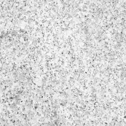 A high-quality image showcasing the natural stone surface with a light, creamy white background and subtle gray and beige speckles, creating a sophisticated and elegant pattern.