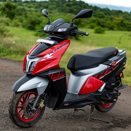 The scooter has a comfortable and ergonomic seating position, with a sporty split-seat design. It is powered by a powerful engine, with a CVT transmission, and it offers sporty performance with quick acceleration and responsive handling. The alt text highlights the scooter's dynamic appearance, performance features, and smart connectivity.