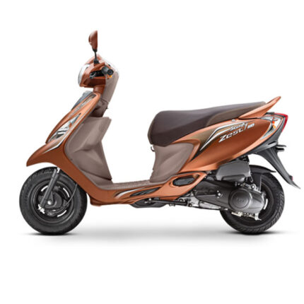 The scooter has a compact and stylish design with sharp lines, a dual-tone body, and vibrant graphics. It features a comfortable seat with a high backrest, telescopic front suspension for a smooth ride, and alloy wheels for stability. The Zest is known for its peppy performance, easy handling, and convenient features, including a large storage space under the seat, a mobile charging socket, and a digital instrument cluster, making it a popular choice for urban commuting and short trips.