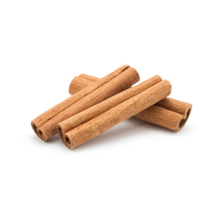 Cinnamon sticks in a bowl, commonly used as a sweet and aromatic spice in baking and cooking.