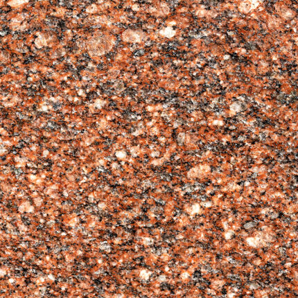 a textured close-up view of the granite's speckled surface featuring a blend of various shades of red, pink, and black, with a glossy finish.