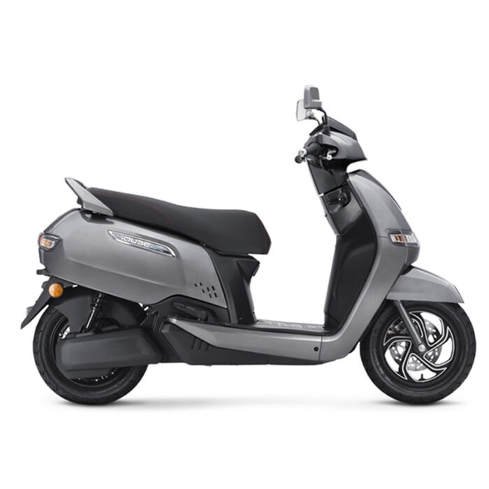 The Scooter Features A Modern And Futuristic Design With Sharp Lines, Led Lighting, And A Large Windscreen. It Has A Compact Body, Alloy Wheels, And A Digital Instrument Cluster. The Scooter Is Powered By An Electric Motor And Has A Removable Lithium-Ion Battery, Offering A Range Of Up To 75 Km Per Charge. It Also Has Regenerative Braking, Smartphone Connectivity, And A Reverse Assist Feature. The Alt Text Highlights The Scooter'S Electric Powertrain, Advanced Features, And Distinctive Appearance.