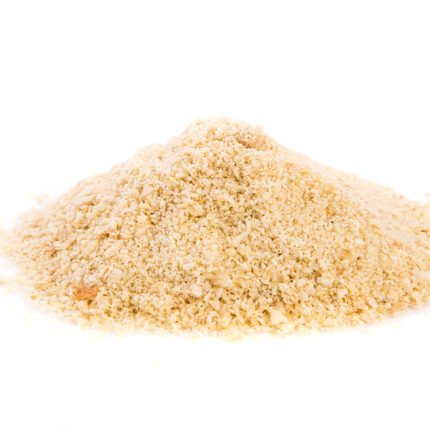 displaying a fine, light brown powder with a smooth texture. The husk particles are visible, indicating the fibrous nature of psyllium.