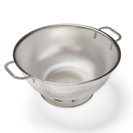 The colander features a classic design with a wide, shallow bowl and evenly spaced perforations for efficient drainage.