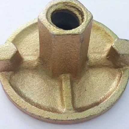 The nut has a round shape and is made of metal with a silver or gray finish. It has threads on the interior to match those of the rod or bolt and is designed to be embedded in concrete or masonry to create a secure connection.
