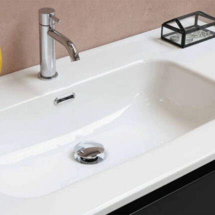 The waste features a metal or plastic body with a drain opening and a lever or knob for controlling the flow of water. It may also have a pop-up mechanism for closing or opening the drain.