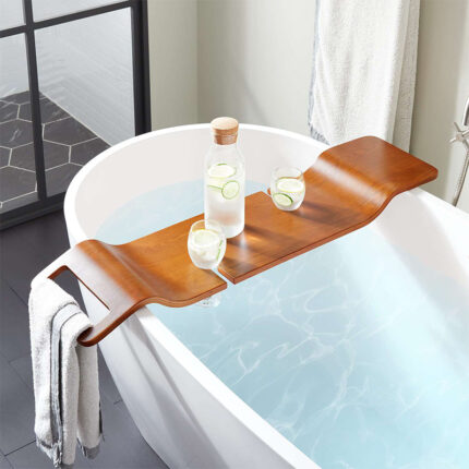 The tray is used to hold items such as books, candles, beverages, or toiletries while relaxing in the bath. It typically has slots or compartments to securely hold different items and may feature an adjustable design to fit various bathtub widths.