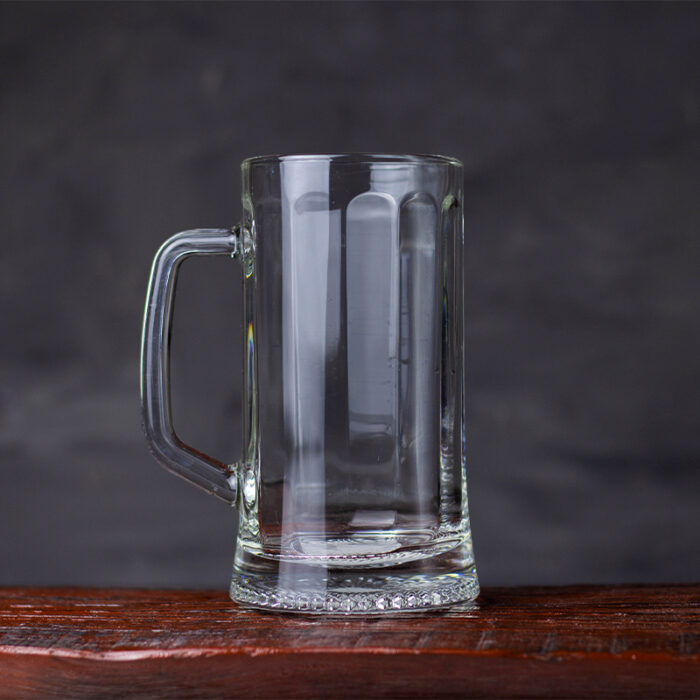 The Beer Mug Is Typically Made Of Thick Glass, Ceramic, Or Stainless Steel, And Has A Sturdy And Robust Appearance.