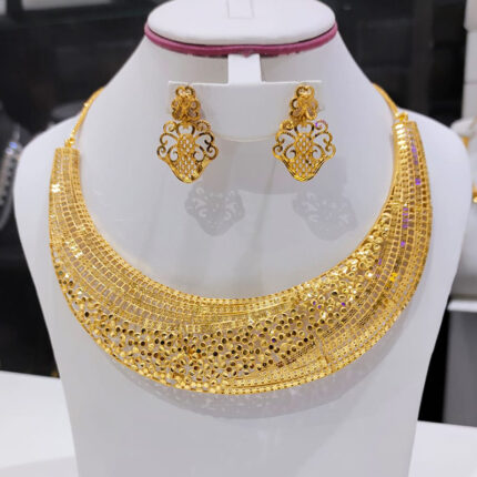 The necklace is a piece of jewelry worn around the neck and may feature a pendant, gemstones, or intricate designs. The earrings are accessories worn on the ears and can be in the form of studs, hoops, or dangling styles. The image may show a matching set where the necklace and earrings complement each other in design and material.