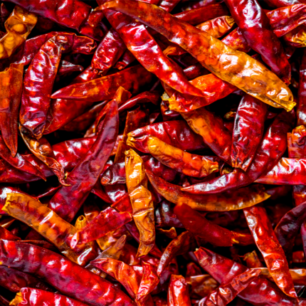 The chillies are small, elongated and slightly curved, with wrinkled skin and a glossy texture. They are widely used in Indian cuisine to add a deep, rich color and mild to moderate heat to dishes such as curries, stews, and marinades.