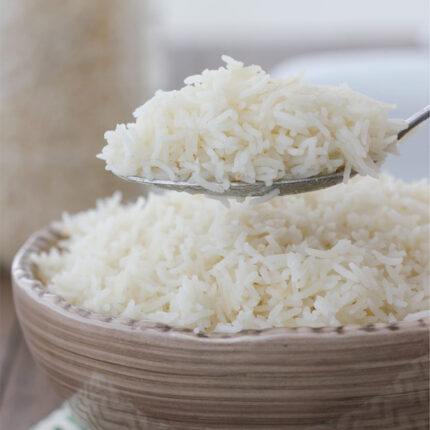 The image may show a bowl of cooked long-grain white rice or a pile of uncooked rice grains. Long-grain white rice is the most common type of rice consumed worldwide.