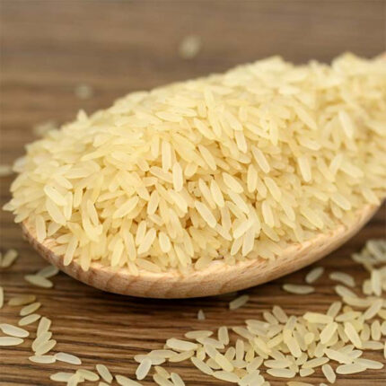 The grains of parboiled rice are medium to long in length and have a light golden or amber color. The image may show a bowl of cooked parboiled rice or a pile of uncooked rice grains.