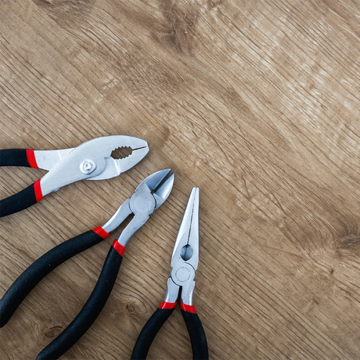 A Pair Of Pliers, A Hand-Held Tool With Two Handles And A Pivot Point, Used For Gripping, Bending, And Cutting Materials Such As Wire And Metal. Pliers Come In A Variety Of Shapes And Sizes, Including Needle-Nose Pliers, Slip-Joint Pliers, And Wire Cutters, And Are Commonly Used In Electrical Work, Automotive Repair, And Other Applications That Require Precision Gripping And Manipulation Of Materials.