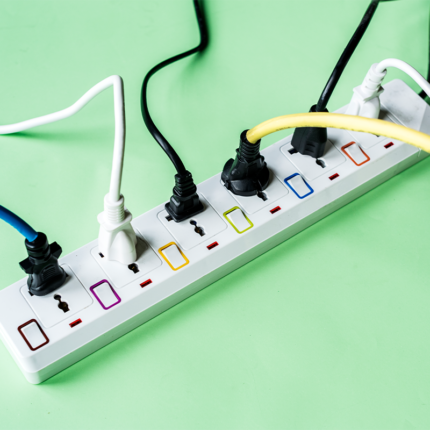 The surge protector may have multiple power outlets, usually arranged in a strip or block format, along with a power cord and a main power switch.