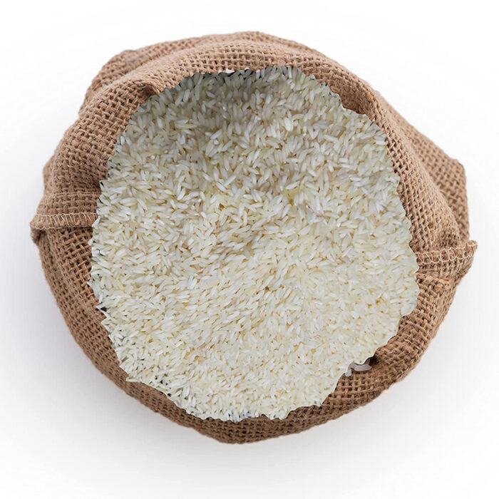 Tulaipanji Rice Or A Pile Of Uncooked Rice Grains. Tulaipanji Rice Is Known For Its Delightful Fragrance, Delicate Flavor, And Tender Texture. It Has A Soft And Fluffy Texture When Cooked, With Grains That Remain Separate.