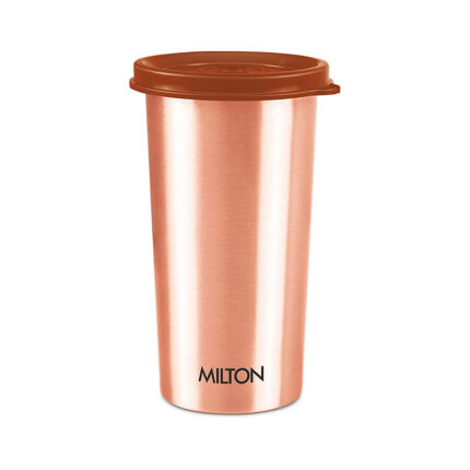 The tumbler has a cylindrical shape with a wide opening and straight sides. It is made from a transparent material such as glass or plastic, allowing the contents to be visible.