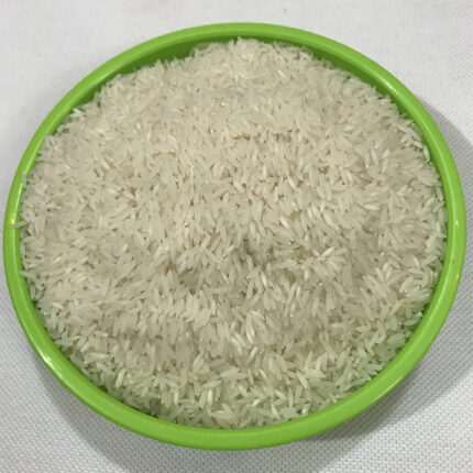 Wada Kolam rice or a pile of uncooked rice grains. Wada Kolam rice is known for its unique flavor, rich aroma, and excellent taste.