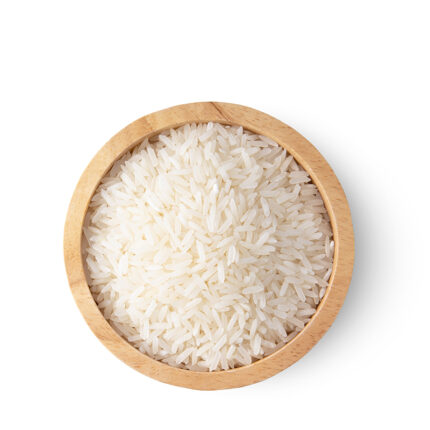 The image may show a bowl of cooked white rice or a pile of uncooked rice grains. White rice is the most processed form of rice, where the husk, bran, and germ are removed, resulting in a polished appearance.