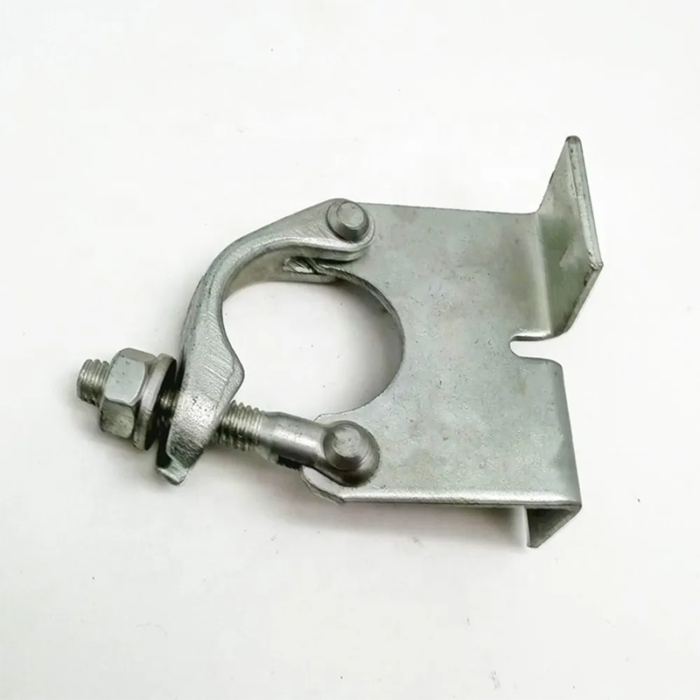 Small Metal Device Used To Secure Two Adjacent Boards Together. The Coupler Consists Of Two Prongs That Fit Into Pre-Drilled Holes In Each Board And A Threaded Rod That Connects The Prongs, Tightening Them Together To Create A Tight Joint.