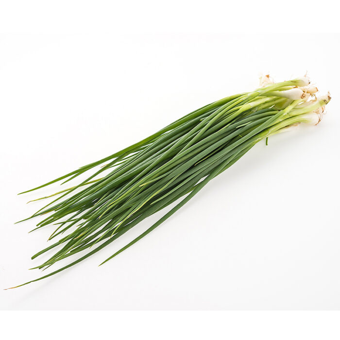 The Chives Are Arranged In A Tight Cluster, With Thin, Hollow Stems And Small, Round Leaves At The Top. Chives Are Commonly Used As A Garnish Or Seasoning In Various Dishes, Including Soups, Salads, And Sauces.