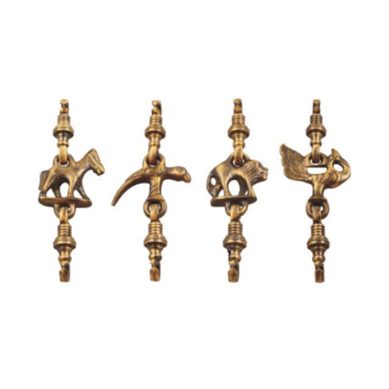 A miniature brass swing toy with intricate detailing, designed in the Sakad style.