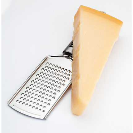 Stainless steel cheese grater with sharp, jagged holes for grating cheese.