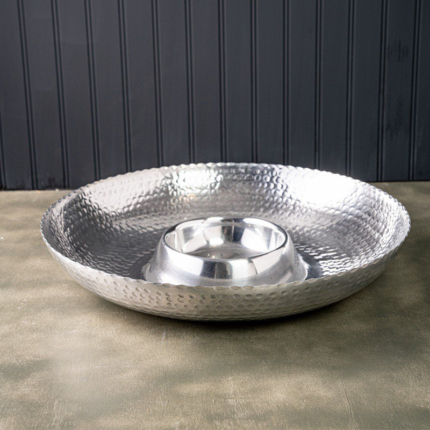 A serving set consisting of a larger bowl or platter for holding chips, crisps, or other snack items, accompanied by a smaller bowl or compartment for holding dip, salsa, or sauce.