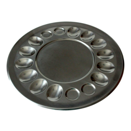 A dish specifically designed for serving eggs. An egg plate typically has compartments or wells to hold individual eggs, keeping them separated and preventing them from rolling around.