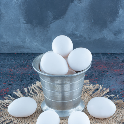 It is typically made of metal, ceramic, or wood and features a stable base with curved or indented sections to cradle individual eggs.