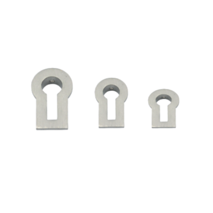 Keyhole-shaped decorative accessory for doors and cabinets.