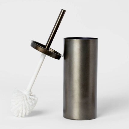 A toilet brush with a matching holder for storage and cleanliness. The toilet brush typically consists of a long handle with bristles on one end, designed for cleaning the inside of a toilet bowl.